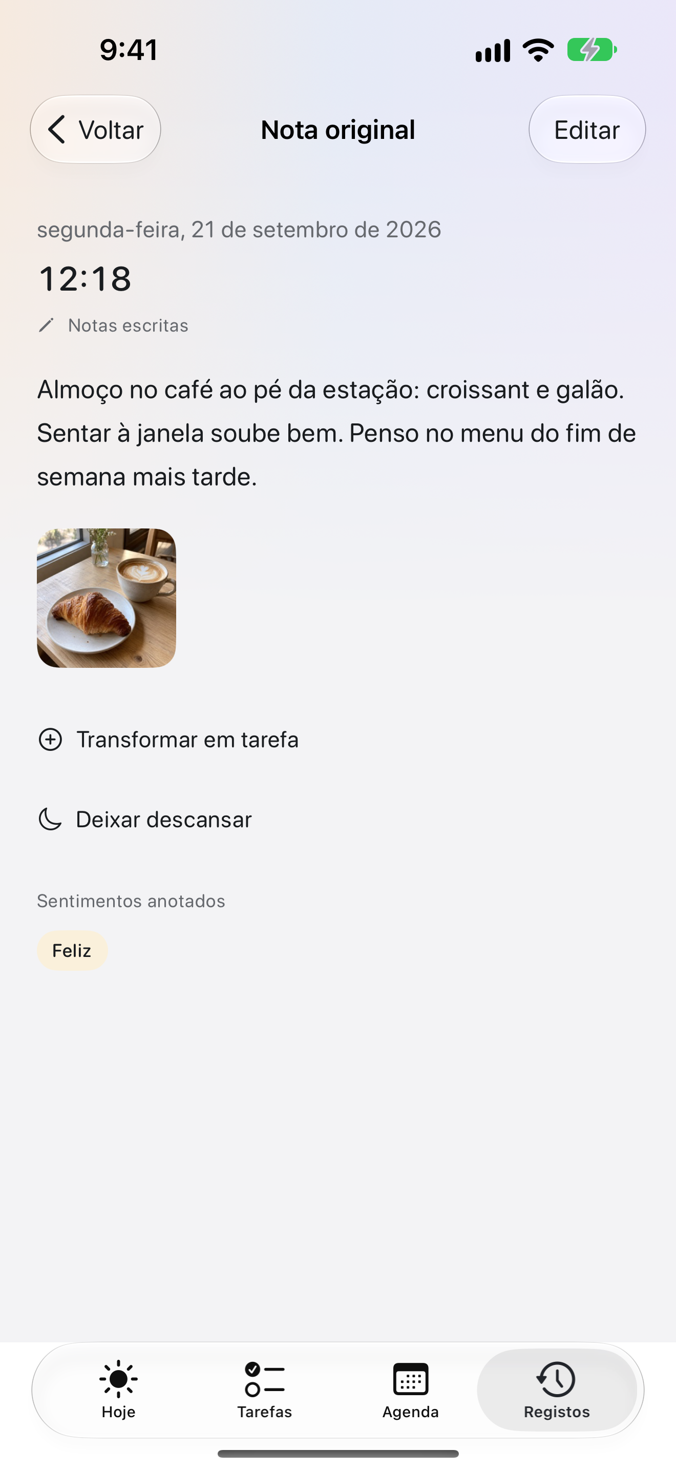 Detalhes de uma entrada do diário no OK Planner, com uma fotografia, o texto e o estado de espírito guardado